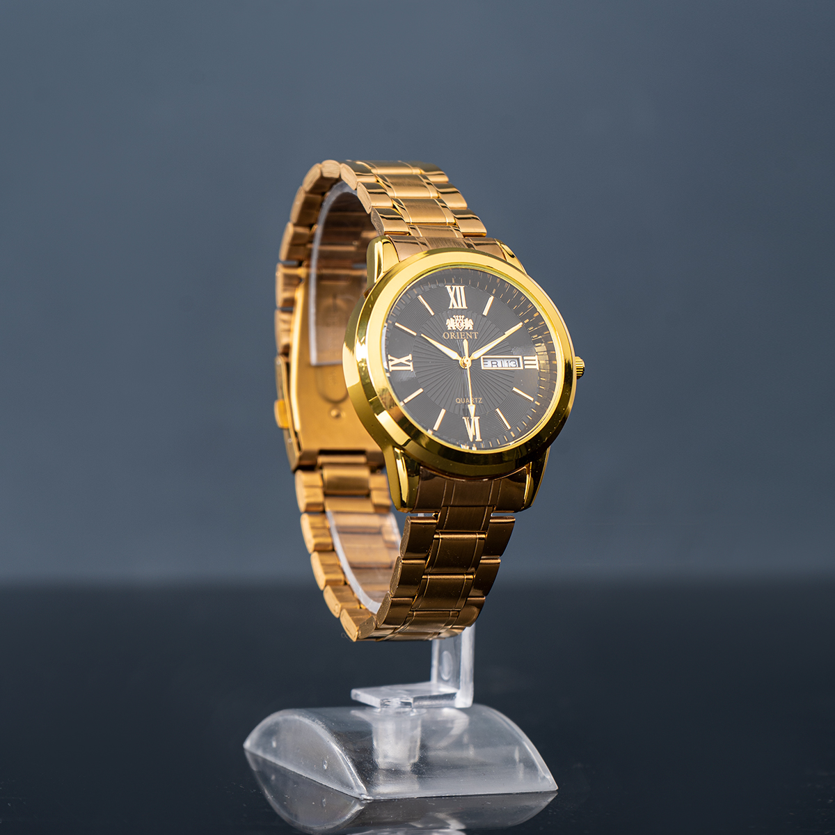 ساعت مچی Orient طلایی صفحه مشکی مدل Z20