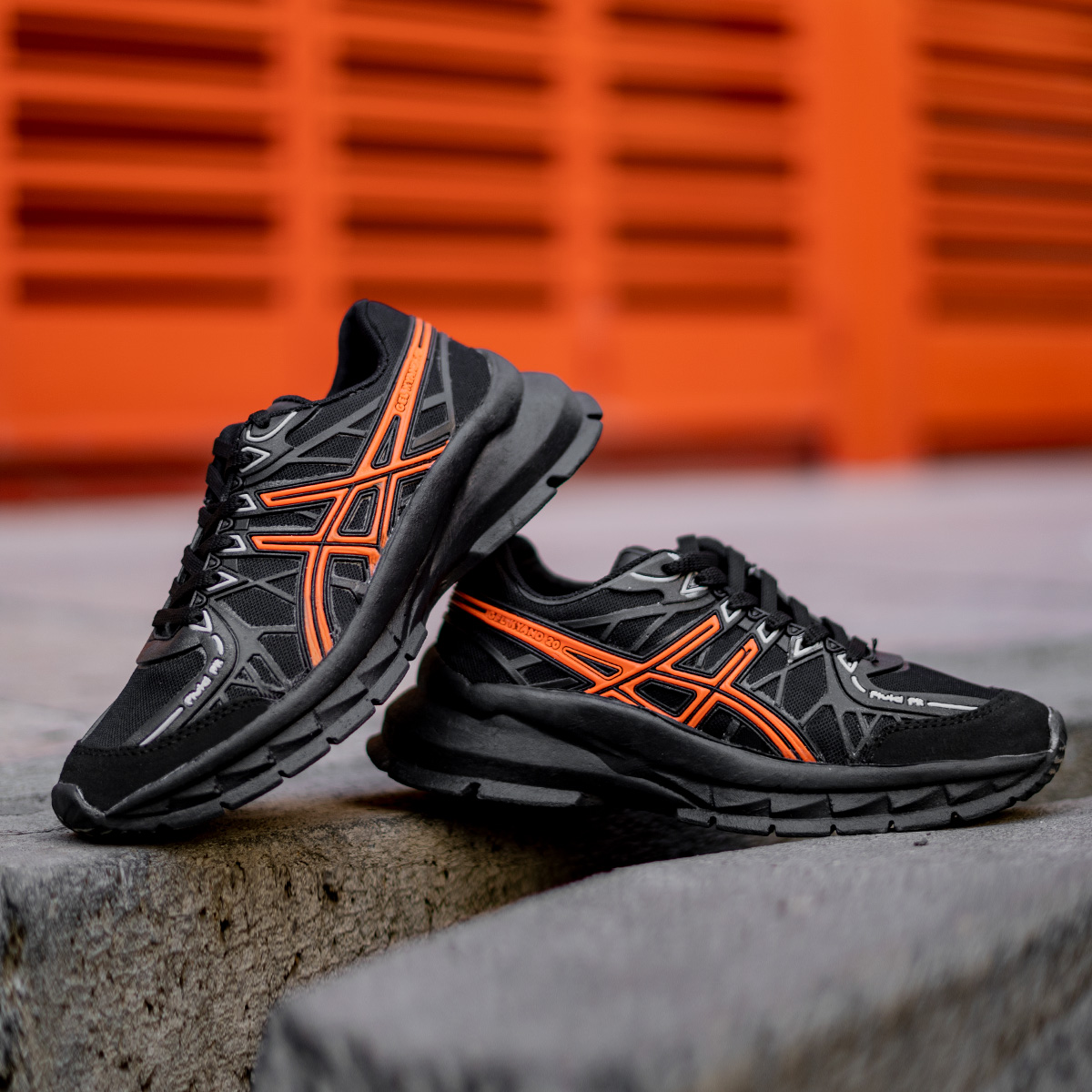 کفش ورزشی Asics زنانه مشکی نارنجی مدل Tina